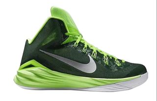 Forest green basketball shoes with a lime green trim and tongue, and a white outsole. A silver Nike swoosh is on the side of the shoe.