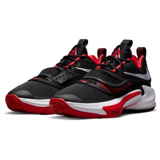 Black basketball shoes with a red outsole, white midsole, and a silver Nike swoosh around the ankle of the shoe.