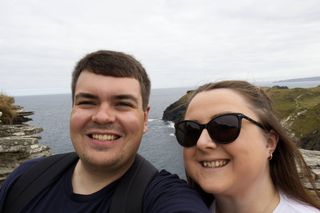 An attempt at a selfie by Declan and Becka with the Tintagel coastline behind them.