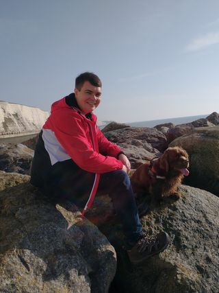 Declan and his dog Bruno sat on the rocks on Rottingdean beach.